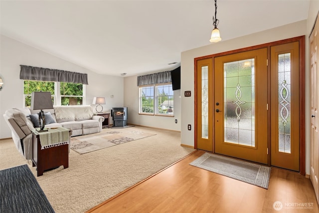 16116 4th Ave NW, Arlington, WA 98223 - entrance foyer with wood finished floors, a wood stove, and lofted ceiling