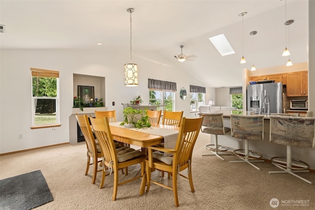 16116 4th Ave NW, Arlington, WA 98223 - dining room with a skylight, vaulted ceiling, healthy amount of natural light, and light carpet