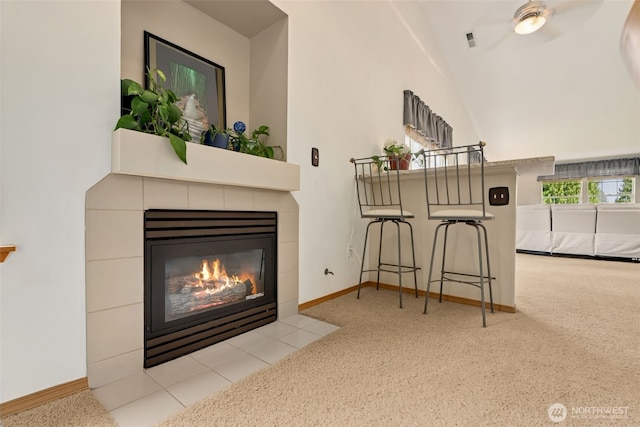 16116 4th Ave NW, Arlington, WA 98223 - detailed view of a tiled fireplace, carpet floors, and a ceiling fan