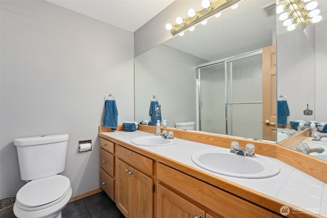 16116 4th Ave NW, Arlington, WA 98223 - full bathroom featuring tile patterned floors, a stall shower, and double vanity