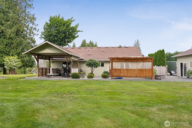 16116 4th Ave NW, Arlington, WA 98223 - rear view of house with a patio area, a lawn, a pergola, and roof with shingles