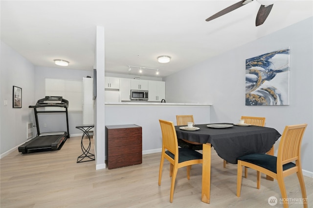 17426 Bothell Way NE Unit A105, Bothell, WA 98011 - dining space featuring light wood-style floors and ceiling fan