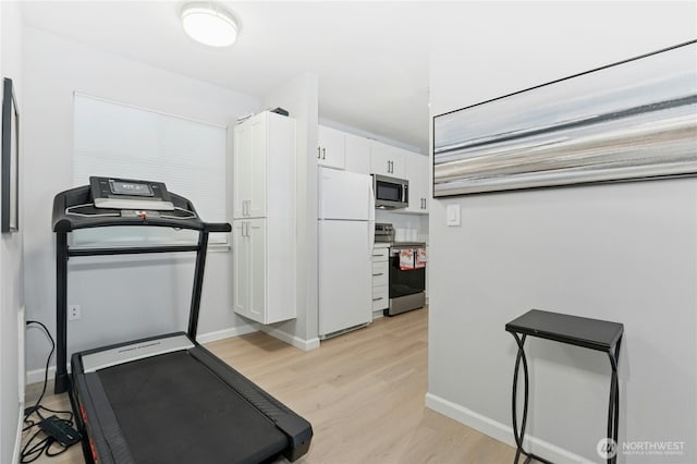 17426 Bothell Way NE Unit A105, Bothell, WA 98011 - workout room with light wood finished floors and baseboards