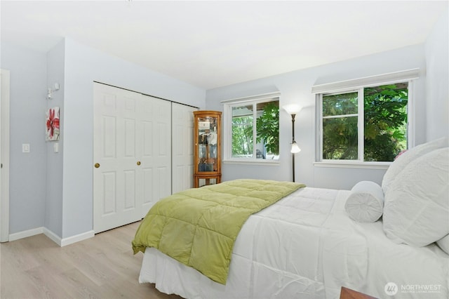17426 Bothell Way NE Unit A105, Bothell, WA 98011 - bedroom featuring wood finished floors and a closet