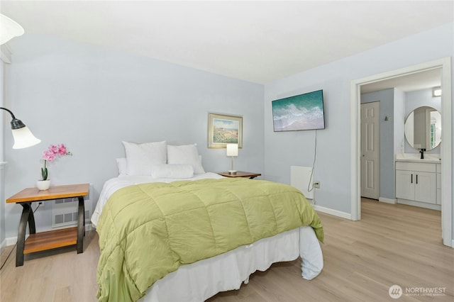 17426 Bothell Way NE Unit A105, Bothell, WA 98011 - bedroom featuring light wood-style flooring and baseboards
