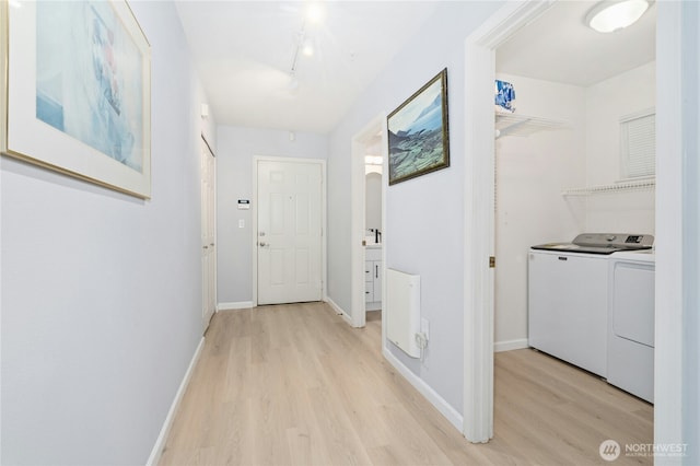 17426 Bothell Way NE Unit A105, Bothell, WA 98011 - hallway featuring washer and dryer and light wood-style floors