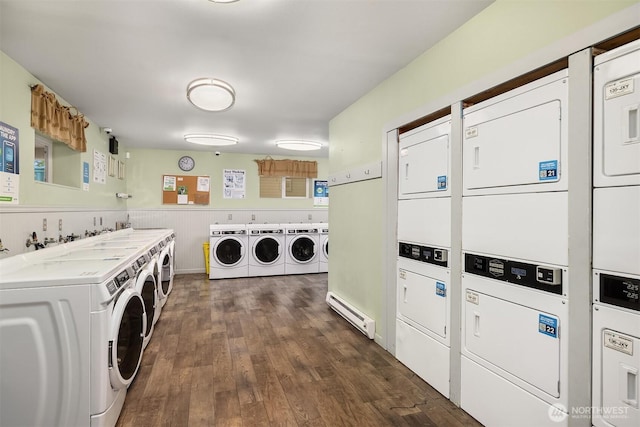 17431 Ambaum Blvd S Unit C24, Burien, WA 98148 - shared laundry room with estacked washer and dryer, washing machine and dryer, dark wood-style floors, and baseboard heating