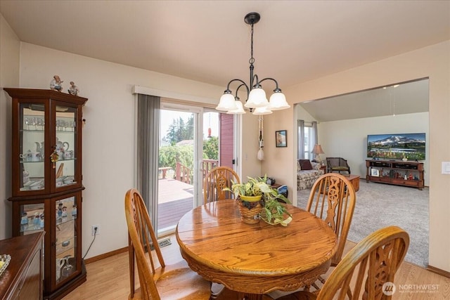 1890 Edgewood Dr, Camano Island, WA 98282 - dining area featuring a chandelier and light wood finished floors