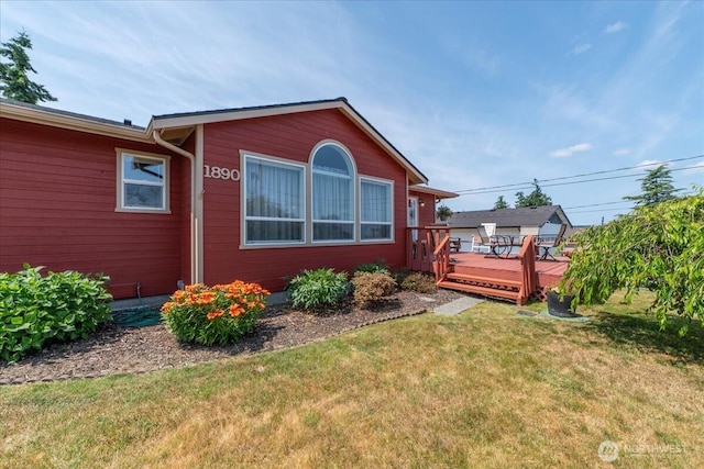 1890 Edgewood Dr, Camano Island, WA 98282 - view of home's exterior with a deck and a yard