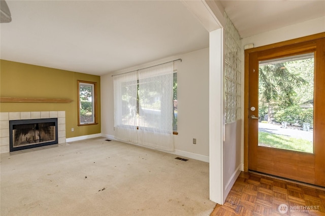 20713 NE 44th St, Sammamish, WA 98074 - entryway with healthy amount of natural light and a tiled fireplace