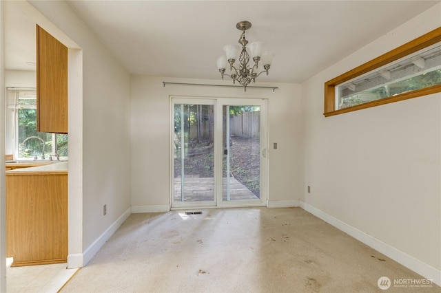 20713 NE 44th St, Sammamish, WA 98074 - unfurnished dining area with a chandelier and light colored carpet