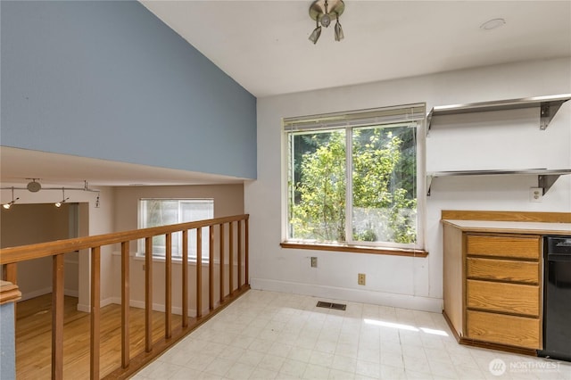 20713 NE 44th St, Sammamish, WA 98074 - unfurnished dining area with baseboards and vaulted ceiling