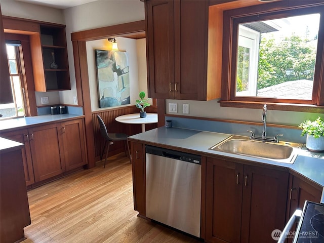 1809 NE 63rd St, Seattle, WA 98115 - kitchen with dishwasher, light wood-type flooring, light countertops, open shelves, and stove