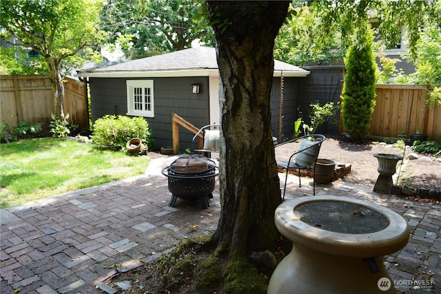 1809 NE 63rd St, Seattle, WA 98115 - fenced backyard featuring a fire pit and a patio