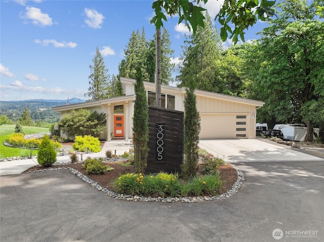 30005 NE 12th Ct, Ridgefield, WA 98642 - mid-century inspired home featuring concrete driveway and an attached garage