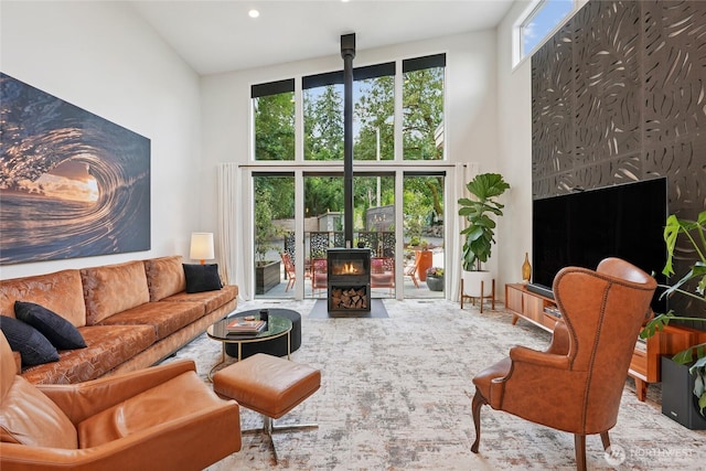 30005 NE 12th Ct, Ridgefield, WA 98642 - living room featuring a wood stove and a high ceiling