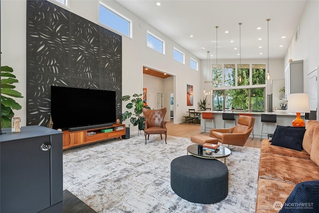 30005 NE 12th Ct, Ridgefield, WA 98642 - living room with a high ceiling, recessed lighting, and light wood finished floors