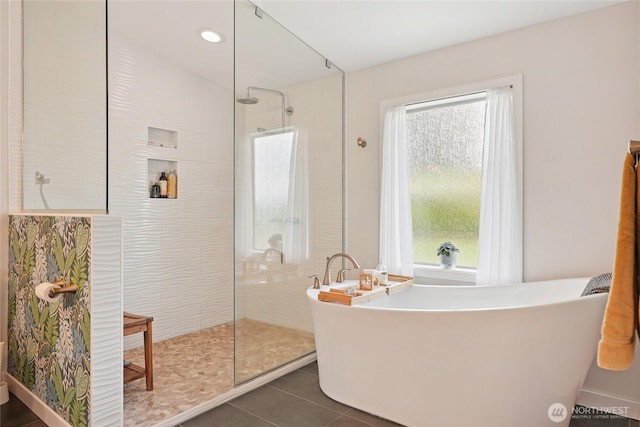 30005 NE 12th Ct, Ridgefield, WA 98642 - bathroom featuring a walk in shower, plenty of natural light, a freestanding bath, and tile patterned flooring