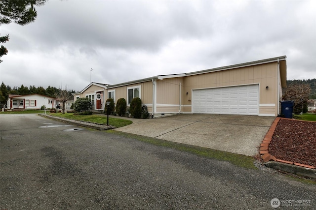 2610 E Section St Unit 85, Mount Vernon, WA 98274 - view of front of property featuring driveway and a garage
