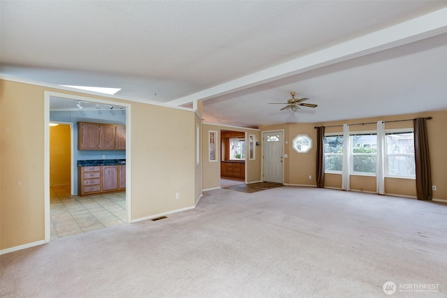 2610 E Section St Unit 85, Mount Vernon, WA 98274 - unfurnished living room with light colored carpet, healthy amount of natural light, and ceiling fan
