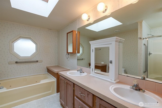 2610 E Section St Unit 85, Mount Vernon, WA 98274 - bathroom featuring a skylight, double vanity, a whirlpool tub, a shower stall, and wallpapered walls