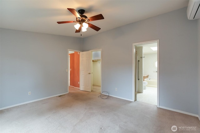 2610 E Section St Unit 85, Mount Vernon, WA 98274 - unfurnished bedroom featuring a wall mounted air conditioner, light carpet, and a walk in closet