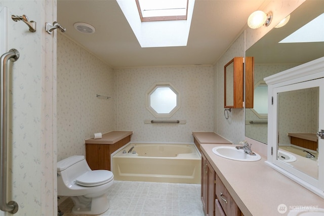 2610 E Section St Unit 85, Mount Vernon, WA 98274 - full bathroom with a tub with jets, a skylight, and double vanity
