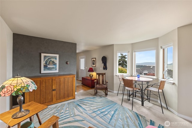 4607 Camano Pl, Anacortes, WA 98221 - living area featuring an accent wall and light colored carpet