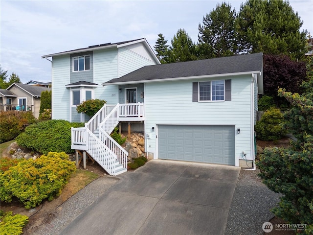 4607 Camano Pl, Anacortes, WA 98221 - traditional home with an attached garage, concrete driveway, and stairway