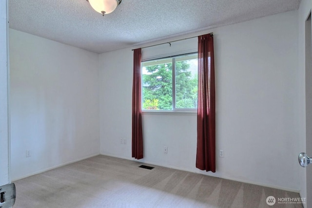5211 53rd St W, University Place, WA 98467 - unfurnished room with a textured ceiling and carpet