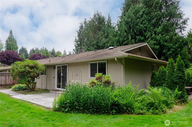 5211 53rd St W, University Place, WA 98467 - back of property featuring a chimney and a patio area