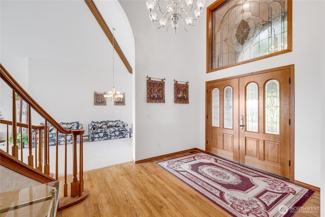1408 W St NW, Auburn, WA 98001 - entryway with a chandelier, a towering ceiling, wood finished floors, and stairs