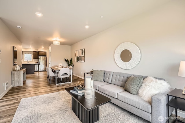 1823 SW 96th Ln, Seattle, WA 98106 - living area featuring wood finished floors and recessed lighting