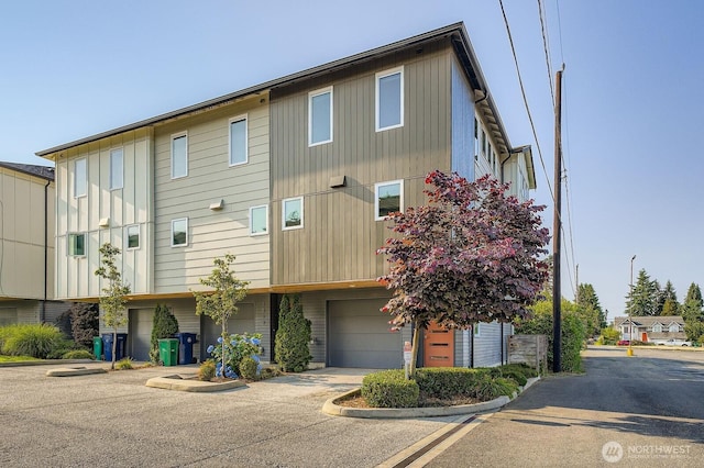 1823 SW 96th Ln, Seattle, WA 98106 - view of front of house with an attached garage and concrete driveway