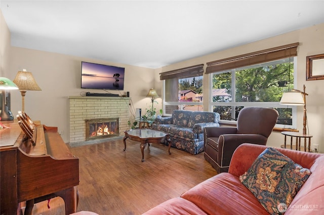 7818 185th Pl SW, Edmonds, WA 98026 - living area with wood finished floors, healthy amount of natural light, and a fireplace