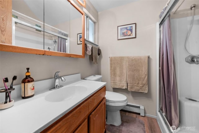 7818 185th Pl SW, Edmonds, WA 98026 - bathroom with baseboard heating, a stall shower, wood finished floors, and vanity