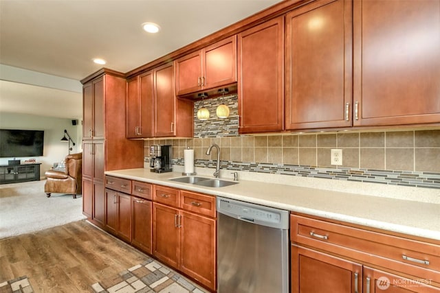 10510 66th Ave E, Puyallup, WA 98373 - kitchen featuring dishwasher, light countertops, open floor plan, decorative backsplash, and recessed lighting
