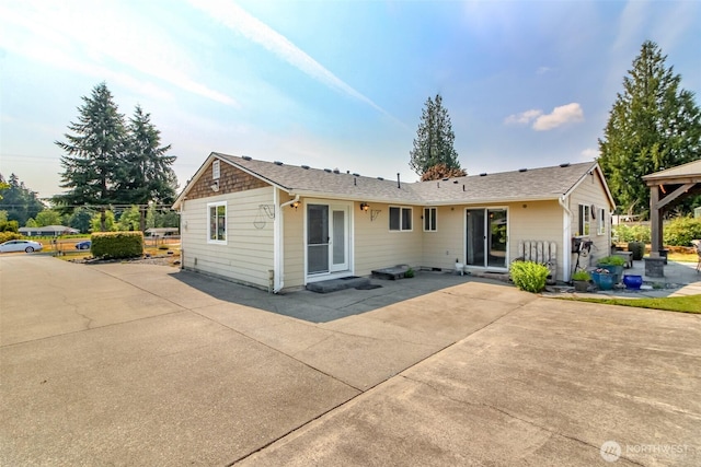 10510 66th Ave E, Puyallup, WA 98373 - rear view of house with a patio