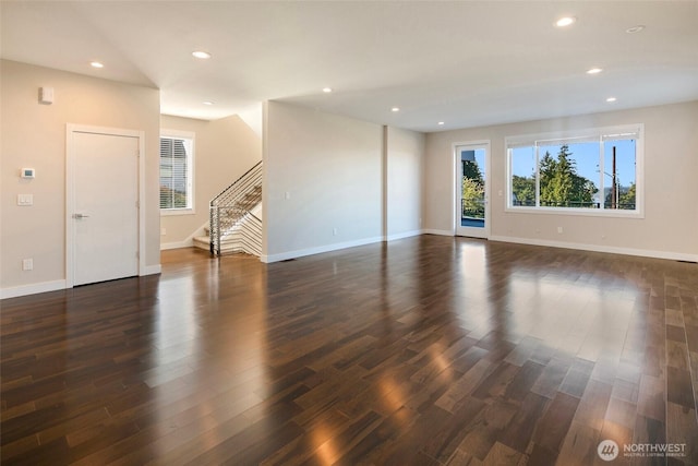11838 79th Ave S, Seattle, WA 98178 - unfurnished living room featuring stairs, dark wood-style flooring, and recessed lighting