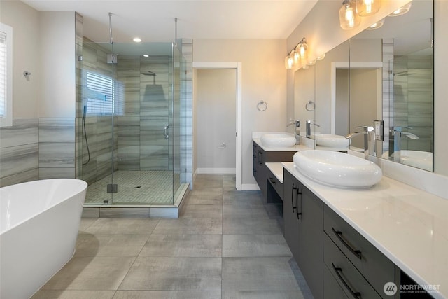 11838 79th Ave S, Seattle, WA 98178 - bathroom with double vanity, a shower stall, a soaking tub, and recessed lighting