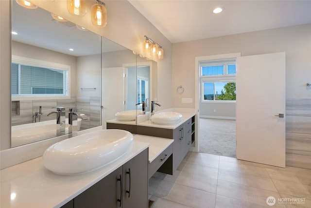 11838 79th Ave S, Seattle, WA 98178 - bathroom featuring two vanities, tile patterned flooring, a tub to relax in, and recessed lighting