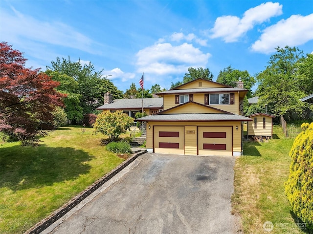 10704 NE 200th Pl, Bothell, WA 98011 - tri-level home with a chimney, driveway, a front lawn, and a garage
