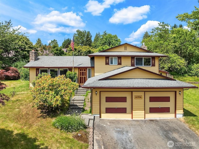 10704 NE 200th Pl, Bothell, WA 98011 - view of front of home with a chimney, a garage, asphalt driveway, and a front yard