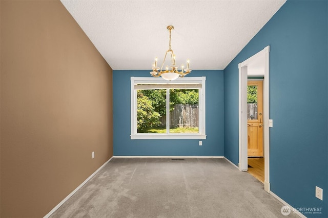 10704 NE 200th Pl, Bothell, WA 98011 - empty room featuring a chandelier, carpet, and a textured ceiling