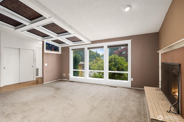 10704 NE 200th Pl, Bothell, WA 98011 - unfurnished living room featuring carpet, coffered ceiling, beam ceiling, a textured ceiling, and a brick fireplace