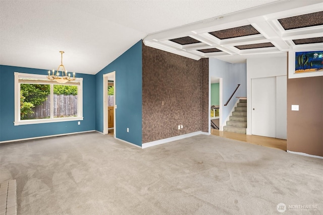10704 NE 200th Pl, Bothell, WA 98011 - empty room with carpet flooring, stairway, a chandelier, coffered ceiling, and beam ceiling