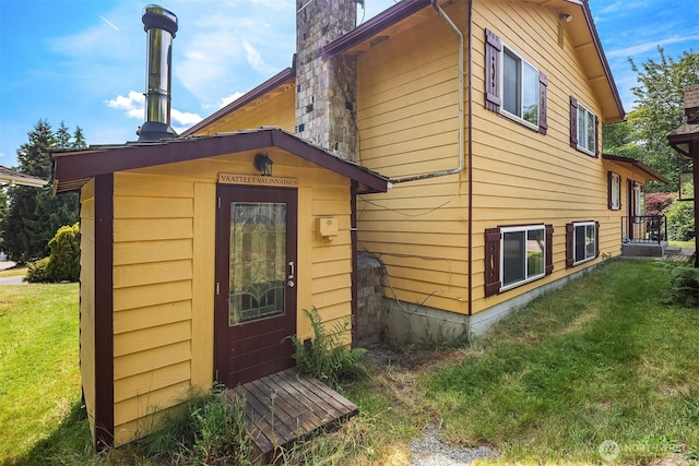 10704 NE 200th Pl, Bothell, WA 98011 - exterior space with a yard, an outdoor structure, and a chimney