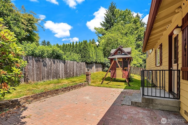 10704 NE 200th Pl, Bothell, WA 98011 - fenced backyard with a playground and a patio