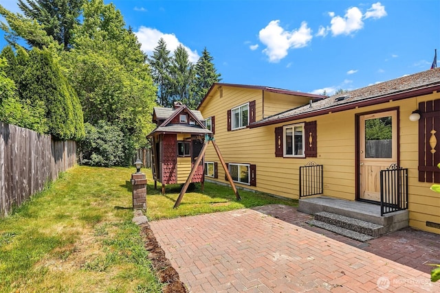 10704 NE 200th Pl, Bothell, WA 98011 - rear view of property featuring a patio and a playground