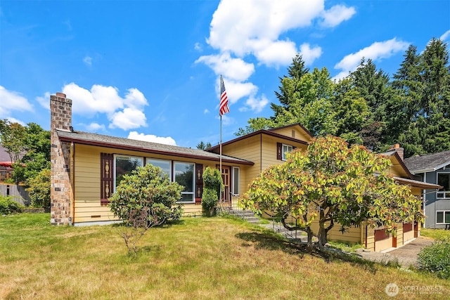 10704 NE 200th Pl, Bothell, WA 98011 - tri-level home featuring a front lawn, a chimney, and a garage